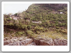 Water sign on hillside - water will be 135 meters in 2003 and 175 meters in 2009