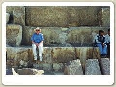 John sitting on the huge stones at the Great Pyramids